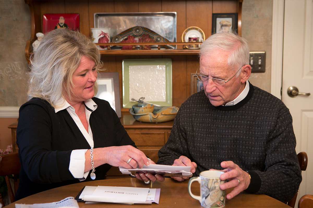 Daughter and father sitting at table